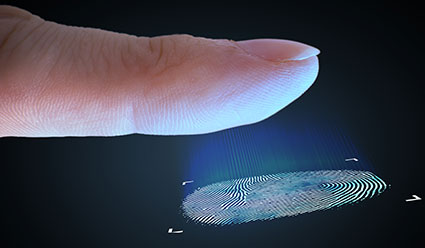 close-up of index finger and finger print against dark background - biometerics