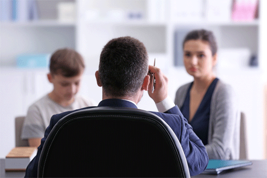 school meeting between student, teacher and parent