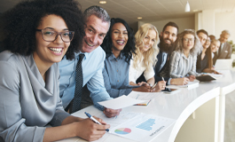 row of diverse employees looking at camera