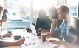 employees meeting around table